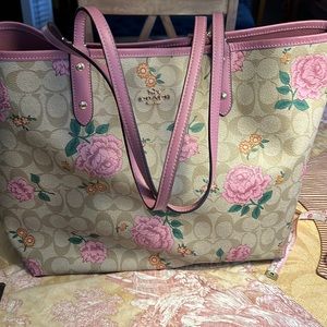 This is a coach bag 18 inches across the top 13 inches on the bottom,reversible
